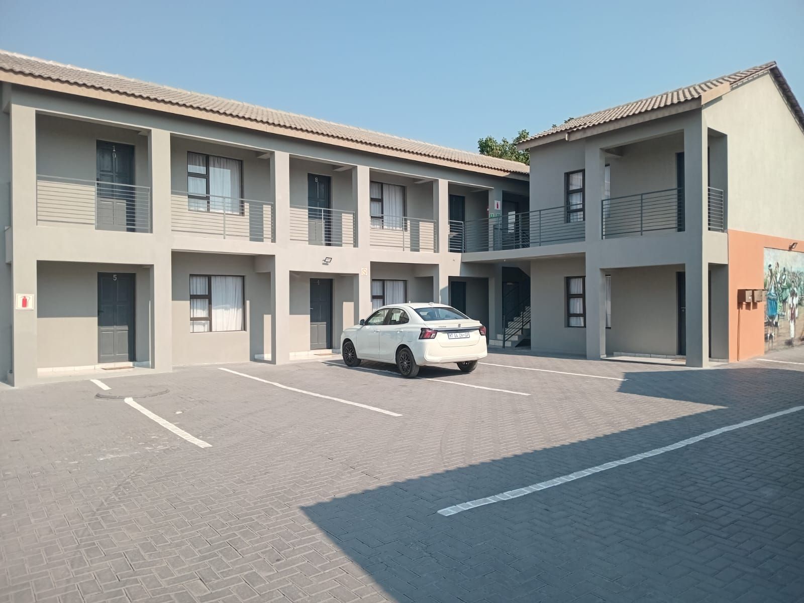 The garden and parking court at Tsonga Luxury Apartments