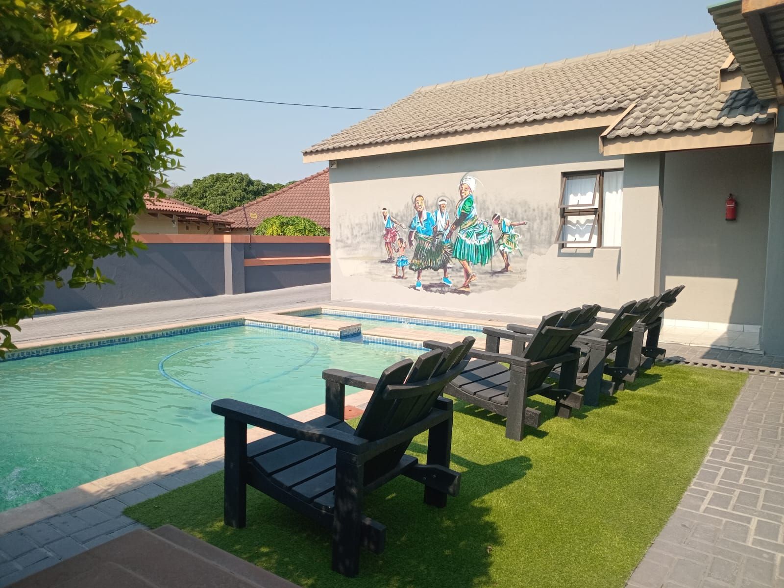 Poolside seating — Tsonga Luxury Apartments